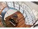 Modern glass spiral staircase with metal accents and hardwood floors at 341 E Monte Vista Rd, Phoenix, AZ 85004
