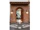 Open arched entryway revealing a grand staircase and elegant interior at 341 E Monte Vista Rd, Phoenix, AZ 85004