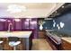 Modern kitchen with purple appliances, marble countertops, and artistic backsplash at 341 E Monte Vista Rd, Phoenix, AZ 85004