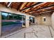 Spacious recreation room with high ceilings, wood beams, and tiled floors at 341 E Monte Vista Rd, Phoenix, AZ 85004