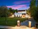 Stunning Spanish-style home with a beautifully landscaped lawn and brick driveway at 341 E Monte Vista Rd, Phoenix, AZ 85004