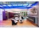 Modern kitchen with purple cabinets and island seating at 341 E Monte Vista Rd, Phoenix, AZ 85004