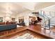 Spacious living room with hardwood floors, a grand staircase, and a piano at 341 E Monte Vista Rd, Phoenix, AZ 85004