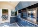 Luxury outdoor kitchen with stainless steel appliances and blue cabinetry at 341 E Monte Vista Rd, Phoenix, AZ 85004