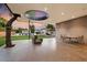 Covered patio with seating area and a view of the backyard and pool at 341 E Monte Vista Rd, Phoenix, AZ 85004