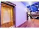 Modern home elevator with glass and wood finishes, adding convenience and luxury at 341 E Monte Vista Rd, Phoenix, AZ 85004