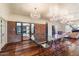 Modern dining room with glass table, brick wall and chandelier at 341 E Monte Vista Rd, Phoenix, AZ 85004