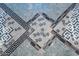 Intricate mosaic tile floor with geometric and floral patterns at 341 E Monte Vista Rd, Phoenix, AZ 85004
