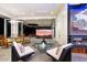 Indoor patio with retractable doors and large TV at 341 E Monte Vista Rd, Phoenix, AZ 85004