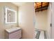 Modern bathroom with a floating vanity and illuminated mirror at 341 E Monte Vista Rd, Phoenix, AZ 85004