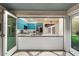 Modern kitchen with teal cabinets and a pass-through window at 341 E Monte Vista Rd, Phoenix, AZ 85004