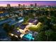 Stunning aerial view of a home with a pool and city skyline at 341 E Monte Vista Rd, Phoenix, AZ 85004