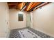 Spacious bedroom with wood beamed ceilings and patterned tile floor at 341 E Monte Vista Rd, Phoenix, AZ 85004