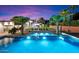 Inviting pool area with palm trees and a spacious patio at 341 E Monte Vista Rd, Phoenix, AZ 85004