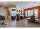 Bright dining room with rustic wood table and orange walls at 4333 S Pony Rider Trl, Gold Canyon, AZ 85118