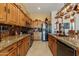 Kitchen boasts granite countertops, stainless steel appliances, and ample wood cabinetry at 4333 S Pony Rider Trl, Gold Canyon, AZ 85118