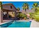 Enjoy this beautiful pool with a covered patio and lush landscaping at 4333 S Pony Rider Trl, Gold Canyon, AZ 85118