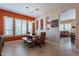 Charming dining area with rustic wooden table and seating at 4333 S Pony Rider Trl, Gold Canyon, AZ 85118