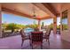 Covered patio with seating area overlooking the pool at 4333 S Pony Rider Trl, Gold Canyon, AZ 85118