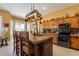 Kitchen boasts granite countertops and wood cabinetry at 4333 S Pony Rider Trl, Gold Canyon, AZ 85118