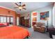 Main bedroom featuring a king-size bed and an adjacent bathroom at 4333 S Pony Rider Trl, Gold Canyon, AZ 85118