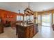 Island kitchen with granite countertops, stainless steel appliances, and custom wood cabinetry at 4333 S Pony Rider Trl, Gold Canyon, AZ 85118