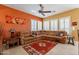 Relaxing living room with a large leather sectional sofa and southwestern decor at 4333 S Pony Rider Trl, Gold Canyon, AZ 85118
