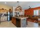 Spacious kitchen featuring granite countertops, stainless steel appliances, and wooden cabinetry at 4333 S Pony Rider Trl, Gold Canyon, AZ 85118