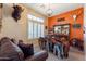 Home bar with saddle stools and western decor at 4333 S Pony Rider Trl, Gold Canyon, AZ 85118