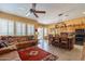 Kitchen with island, copper pot rack, and casual seating area at 4333 S Pony Rider Trl, Gold Canyon, AZ 85118
