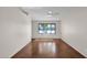 Simple living room with large window and polished concrete floors at 10438 S 45Th Pl, Phoenix, AZ 85044