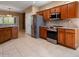 Spacious kitchen with stainless steel appliances and granite countertops at 21438 N Olmsted Point Ln, Surprise, AZ 85387