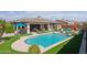 Private backyard with a sparkling pool and patio at 18119 W Narramore Rd, Goodyear, AZ 85338
