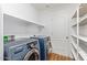 Laundry room with washer, dryer, and shelving at 18337 W Stinson Dr, Surprise, AZ 85374