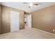 Bedroom with double door closet and access to hallway at 18337 W Stinson Dr, Surprise, AZ 85374