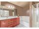 Main bathroom boasts a double vanity, soaking tub, and shower at 18337 W Stinson Dr, Surprise, AZ 85374