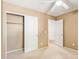 Bedroom with double door closet and ceiling fan at 18337 W Stinson Dr, Surprise, AZ 85374