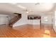 Spacious living room with hardwood floors and kitchen views at 18337 W Stinson Dr, Surprise, AZ 85374