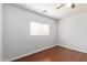 Bright bedroom with wood floors and window blinds at 18337 W Stinson Dr, Surprise, AZ 85374