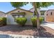 Two-story home with Spanish style architecture and landscaping at 18337 W Stinson Dr, Surprise, AZ 85374