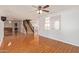 Spacious living room with wood-look tile and staircase at 18337 W Stinson Dr, Surprise, AZ 85374