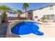 Blue swimming pool with landscaping at 18337 W Stinson Dr, Surprise, AZ 85374