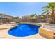 Inviting kidney-shaped pool with surrounding landscaping at 18337 W Stinson Dr, Surprise, AZ 85374