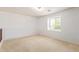 Bright bedroom with neutral walls and carpet flooring at 18337 W Stinson Dr, Surprise, AZ 85374