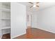 Bedroom with built-in shelving and hardwood floors at 18337 W Stinson Dr, Surprise, AZ 85374