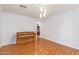Spacious dining area with hardwood floors and a piano at 18337 W Stinson Dr, Surprise, AZ 85374