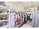 Walk-in closet with ample shelving and hanging space at 5389 S Scott Pl, Chandler, AZ 85249