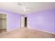 Lavender bedroom with ceiling fan and window at 5389 S Scott Pl, Chandler, AZ 85249