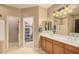Double vanity bathroom with a large walk-in closet at 5389 S Scott Pl, Chandler, AZ 85249
