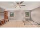 Bright bedroom featuring a ceiling fan and built-in shelving at 5389 S Scott Pl, Chandler, AZ 85249